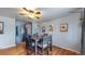 Dining area with hardwood floors and table for four at 1242 Elder St, Denver, CO 80221