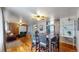 Dining area with hardwood floors, table and seating at 1242 Elder St, Denver, CO 80221