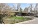 Brick ranch house with carport and fenced yard at 1242 Elder St, Denver, CO 80221