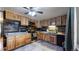 Modern kitchen featuring stainless steel appliances and wood cabinets at 1242 Elder St, Denver, CO 80221