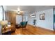 Living room with hardwood floors, couch and TV at 1242 Elder St, Denver, CO 80221