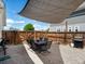 Charming backyard with patio set, shade cover, and a fenced-in yard at 3134 W Center Ave, Denver, CO 80219