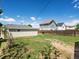 Backyard with detached garage and wooden fence at 3134 W Center Ave, Denver, CO 80219