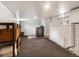Unfinished basement featuring dark carpet and white walls with a washer and dryer at 3134 W Center Ave, Denver, CO 80219