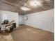 Spacious unfinished basement featuring white walls, concrete flooring and potential for customization at 3134 W Center Ave, Denver, CO 80219