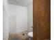 Incomplete bathroom with a new toilet and potential to be finished to your taste at 3134 W Center Ave, Denver, CO 80219