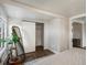 Bedroom featuring a closet with a partially open sliding door and a leaning mirror at 3134 W Center Ave, Denver, CO 80219