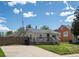 Exterior view of home featuring a cute front deck and driveway at 3134 W Center Ave, Denver, CO 80219