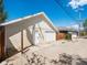Detached two-car garage with white doors at 3134 W Center Ave, Denver, CO 80219