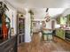 Open kitchen featuring an island, stainless steel appliances, and green cabinets at 3134 W Center Ave, Denver, CO 80219