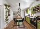 Kitchen with open layout and wood-topped island at 3134 W Center Ave, Denver, CO 80219