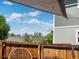 View from the yard overlooking the city skyline with mature trees and a blue sky at 3134 W Center Ave, Denver, CO 80219
