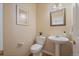 The powder room has a pedestal sink, and decorative accessories at 6004 W Colorado Ln, Lakewood, CO 80232