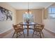 Dining room with hardwood floors, and large windows offers plenty of natural light at 6004 W Colorado Ln, Lakewood, CO 80232