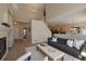 Bright living room featuring neutral walls, plush carpet, and modern furniture at 6004 W Colorado Ln, Lakewood, CO 80232