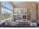 Cozy living room with a fireplace and built-in shelves provides ample storage at 6004 W Colorado Ln, Lakewood, CO 80232