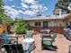 Backyard patio with outdoor seating, fire pit, and well-maintained landscaping at 10400 W 35Th Pl, Wheat Ridge, CO 80033