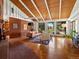 Spacious living room boasting vaulted wood ceilings, brick fireplace, and abundant natural light at 10400 W 35Th Pl, Wheat Ridge, CO 80033