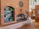 Living room showing a brick fireplace with built-in shelving at 10400 W 35Th Pl, Wheat Ridge, CO 80033