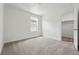 Empty bedroom featuring neutral carpet, a window, and closet space at 2079 Generations Aly, Brighton, CO 80601
