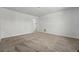 Empty bedroom with neutral carpet featuring a walk-in closet at 2079 Generations Aly, Brighton, CO 80601