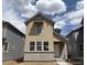 Charming two-story home featuring beige siding, stone accents, and well-placed windows at 2079 Generations Aly, Brighton, CO 80601
