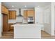 Modern kitchen features stainless steel appliances, wood cabinets and a large center island at 2079 Generations Aly, Brighton, CO 80601