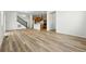 Open concept kitchen and living area with wood floors and recessed lighting at 2079 Generations Aly, Brighton, CO 80601