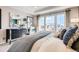 Bright main bedroom boasting a large window, plush carpet, and stylish decor at 2079 Generations Aly, Brighton, CO 80601