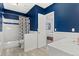 Well-designed bathroom featuring contrasting colors, modern fixtures, and a view to bedroom at 3819 S Waco St, Aurora, CO 80013