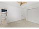 Bright bedroom with ceiling fan offering ample space and natural light, plus ensuite bathroom at 3819 S Waco St, Aurora, CO 80013