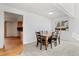 Dining room with hardwood floors visible from the kitchen at 3819 S Waco St, Aurora, CO 80013