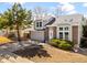 Two-story home with brick accents, an attached two-car garage, and a well-manicured lawn at 3819 S Waco St, Aurora, CO 80013