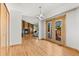 Open floor plan features a brick fireplace and access to the exterior deck at 3819 S Waco St, Aurora, CO 80013