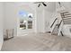 Bright living room features a high ceiling, large windows, and new carpet at 3819 S Waco St, Aurora, CO 80013