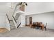 Open floor plan features a staircase and a dining area with hardwood floors at 3819 S Waco St, Aurora, CO 80013