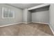 Empty bedroom with neutral paint, carpet, and window, ready for its new occupants to move in and make it their own at 327 Ellie Way, Berthoud, CO 80513