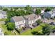 An aerial shot reveals townhomes with private backyards and lush green surroundings at 10819 Summerset Way, Parker, CO 80138