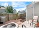 Small backyard with a brick patio, fenced perimeter, and a storage shed at 10819 Summerset Way, Parker, CO 80138