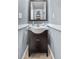 Well-lit half bath showcasing a modern vanity, sink, and stylish fixtures at 10819 Summerset Way, Parker, CO 80138