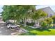 Charming townhome with manicured lawn, mature trees, and ample parking spaces for residents and guests at 10819 Summerset Way, Parker, CO 80138