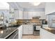 Well-maintained kitchen featuring modern stainless steel appliances and ample countertop space at 10819 Summerset Way, Parker, CO 80138