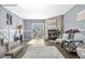 Inviting living room featuring a stone fireplace, hardwood floors, and sliding door to patio at 10819 Summerset Way, Parker, CO 80138