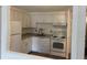 Bright kitchen with white appliances, cabinets and countertops at 8824 E Florida Ave # 103, Denver, CO 80247