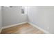 This bedroom features a window, light-colored walls, and wood-look flooring at 3391 W 32Nd Ave, Denver, CO 80211