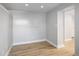 This bedroom features a sliding closet door, light-colored walls, and wood-look flooring at 3391 W 32Nd Ave, Denver, CO 80211