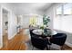 Open floor plan connecting the dining room, and living room, featuring hardwood floors and lots of natural light at 3391 W 32Nd Ave, Denver, CO 80211