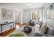 Inviting living room with ample natural light, stylish furniture, and hardwood flooring at 3391 W 32Nd Ave, Denver, CO 80211