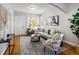 Cozy living room featuring hardwood floors, neutral color palette, and comfortable seating arrangement at 3391 W 32Nd Ave, Denver, CO 80211