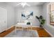 Office space with hardwood floors, a white desk, and natural light at 3391 W 32Nd Ave, Denver, CO 80211